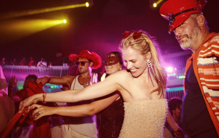 Guests dancing during Scarlet Night on Virgin Voyages cruise ship.