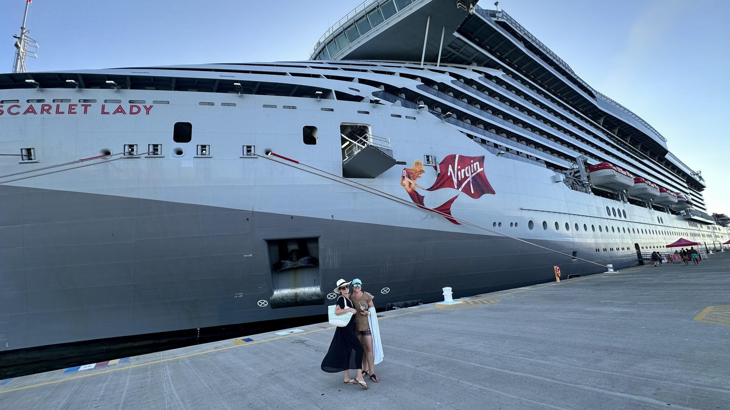 Virgin Voyages Lady Ship docked at the cruise terminal on turnaround day between back-to-back Virgin Voyages cruises